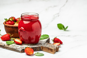 Jar of strawberry jam on white background. Homemade strawberry marmelade and fruits. Long banner...