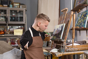 a man with disabilities draws pictures and is engaged in art