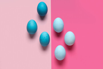 Composition with painted Easter eggs on pink background