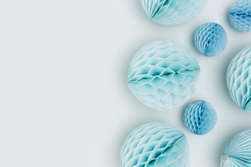 Tissue paper balls different sizes scattered on a blue background. Creative festive concept.