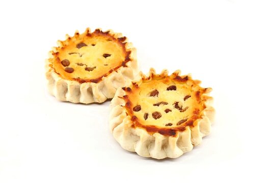 Pardulas or Formaggelle on  white background. It is a typical Sardinian Easter cake made with ricotta or cheese. 