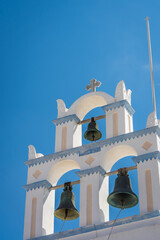 Vertical shot of church bells in Emporio village. Santorini, Greece