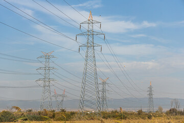 Gray power line is on the blue sky background