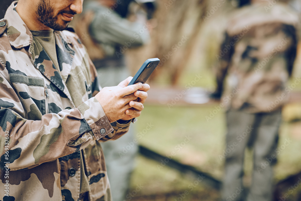 Aufkleber Chat, typing and man with a phone in the army for communication, social media and contact. Website, email and person reading a message on a mobile app while playing paintball on a field with friends