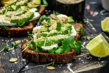 avocado toasts with rye bread, Delicious breakfast or snack, Clean eating, dieting, vegan food concept. top view
