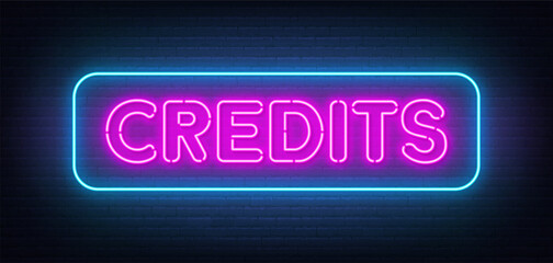Credits neon sign on brick wall background.