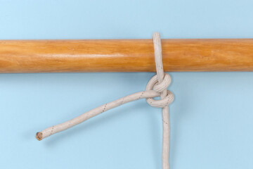 Rope knot Two half hitches tied around a wooden pole
