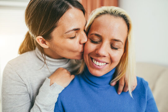 Happy Gay Couple Having Tender Moment At Home - LGBT Love Concept - Main Focus On Right Woman Eye