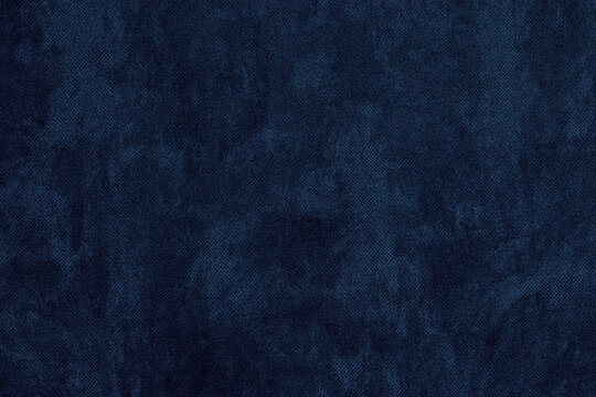 Navy blue color textured surface. Dark textile texture. Indigo colour abstract grunge background © JAYANNPO