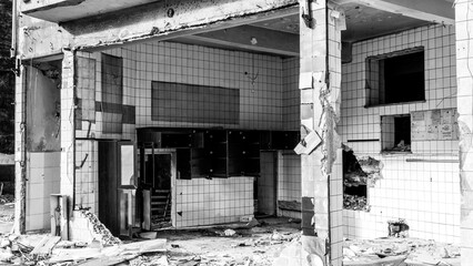 Fototapeta premium Ruined house during the process of urban transformation. Demolition of old buildings. Building demolition in urban transformations