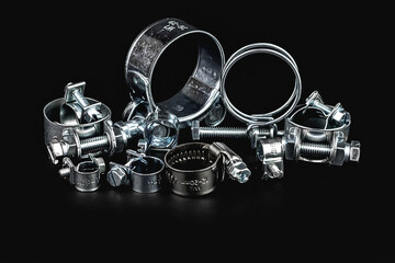 Hose Clamp, Different metal clamps for hose connection isolated on black background, 