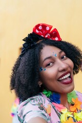 Portrait of an afro woman enjoying carnival in the streets