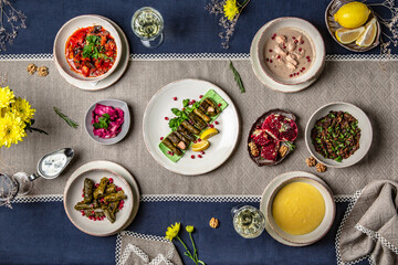 Food Table Celebration Delicious Party Meal Concept. A lot of food on the table: meat, dolma, khachapuri, manti.  Foodset from Georgian dishes. Caucasian food