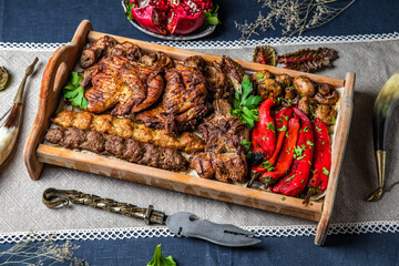 Food Table Celebration Delicious Party Meal Concept. A lot of food on the table: meat, chicken, lamb, beef.  Foodset from Georgian dishes. Caucasian food