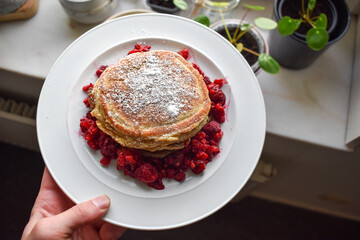 Stack of American-style pancakes with raspberries