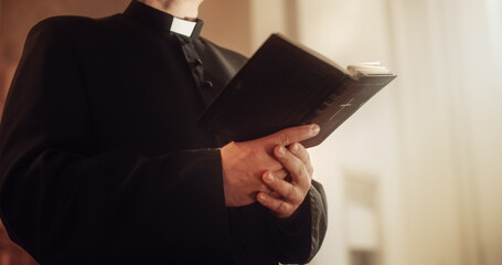 In Christian Church: Close Up of The Bible, Gospel of Jesus. Minister Leads The Congregation In Prayer and Reads From The Holy Book, Priest Providing Guidance, Belief, Hope to People.