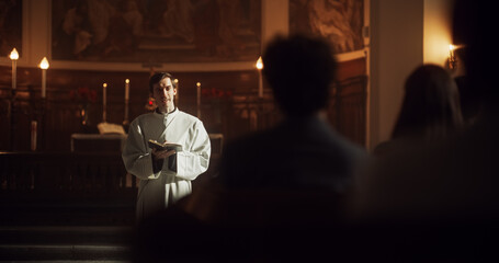 In Christian Church: Portrait of Minister Leading Congregation In Prayer, Reads From Holy Book, The Bible, Gospel of Jesus. Priest Providing Guidance, Belief, Hope, Faith to People. Cinematic Light