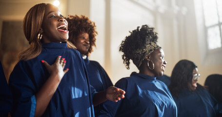 Black Christian Gospel Singers in Church Clapping and Stomping, Praising Lord Jesus Christ. Song Spreads Harmony Joy and Faith. Energetic Choir Sharing the Message of Christianity with Uplifting Music