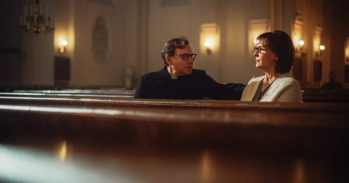Talk in Church: The Pastor's Gentle Voice Brings Comfort and Solace To Senior Parishioner. With Gentle Words of Reassurance He Reminds Woman of the Power of Christian Faith and the Love of God