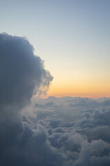 Majestic aerial cloud scape in the sunrise peaceful and religious from the stratosphere with copyspace. Perfect for advertisement or motivational sentences.