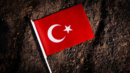 National flag of Turkey on the cracked ground,earthquake concept 2023 tragedy