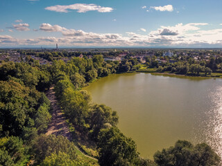 Aerial vIew of Zhudachiv city by drone. Summer Ukraine Lviv region, West Ukraine. Lake.