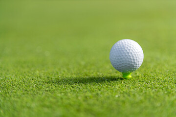 Golf ball on green grass
