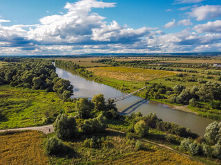 Naklejka premium Aerial vIew of Zhudachiv city by drone. Summer Ukraine Lviv region, West Ukraine. River.