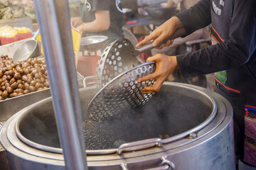 Roasted cashew nuts for sale at the street market in Thailand