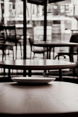 Fototapeta na wymiar Empty coffee table over defocused coffee shop background with copy space - generative ai