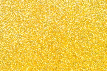 Golden defocused glitter texture as background