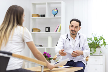 Fototapeta premium Photo of pregnant woman speaking with a doctor.