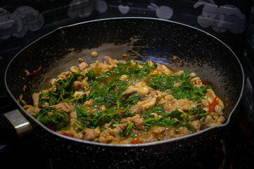 Stir-Fried sliced chicken breast with Basil in pan, Asian food, Easy food, Thai food, Hot basil,
