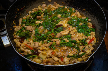 Stir-Fried sliced chicken breast with Basil in pan, Asian food, Easy food, Thai food, Hot basil,