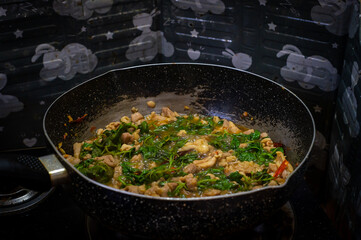 Stir-Fried sliced chicken breast with Basil in pan, Asian food, Easy food, Thai food, Hot basil,