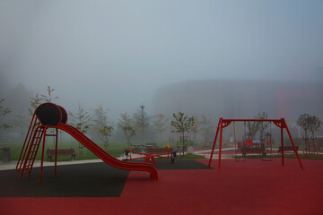 Fototapeta premium Belgrade, Serbia. October 25th, 2022. Empty playground on a cold and foggy winter morning in&nbsp;Belgrade.