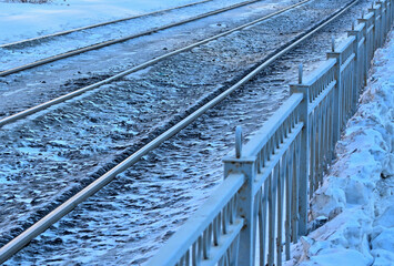Snow-covered tram tracks on a winter day