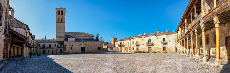 Panoramic view of the main square of the medieval city of Pedraza with its old stone buildings,...