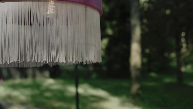 Close-up vintage style lamp torchere with white fringe