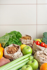 zero waste packaging. Different vegetables and fruits in paper bags on the table