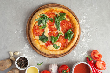 The process of making margarita pizza. Male hands, top view. Tomato paste with cheese.