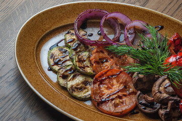 Chopped baked mushrooms, tomatoes, zucchini, pepper and onion rings with dill