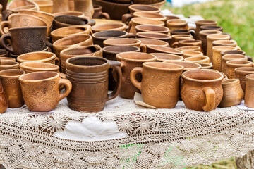 Heap of different clay cups on the table