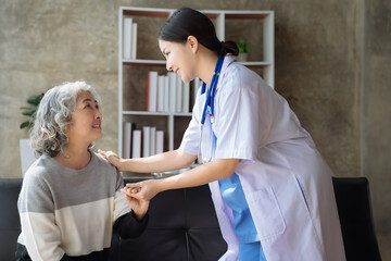Fototapeta premium Female doctor touching patient's shoulder to encourage treatment.