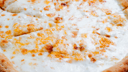 Closeup fresh cheese pizza, traditional italian food. Low angle view, selective focus