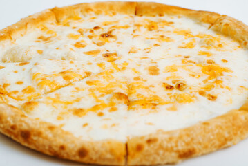 Close-up of cheesy pizza, food of traditional italian cuisine. Low angle view, selective focus