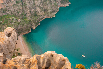 Top view of clear beach and transparent sea of Butterfly Valley. one of the most beautiful beaches in Turkey.