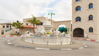 A square decorated with a decorative fountain in the Ghajar Alawite Arab village, located on the...