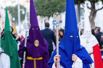 Nazarenes from different brotherhoods during a Holy Week procession. - obrazy, fototapety, plakaty