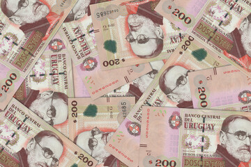 The Uruguayan currency - the Uruguayan peso. Macro view of Uruguay paper money. Close-up Uruguay...